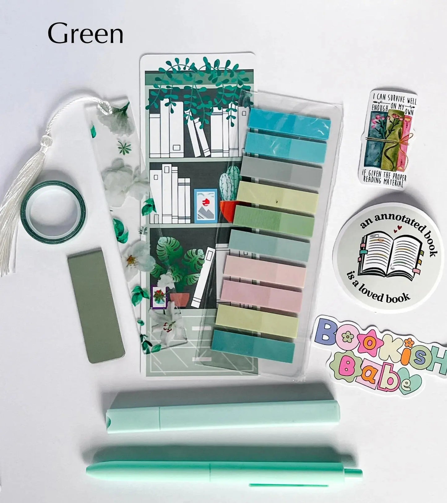 Flat lay of the Book Annotation Kit featuring highlighters, sticky notes, page tabs, pens, and other colorful tools for annotating and marking up books, all neatly arranged in a clear pouch."