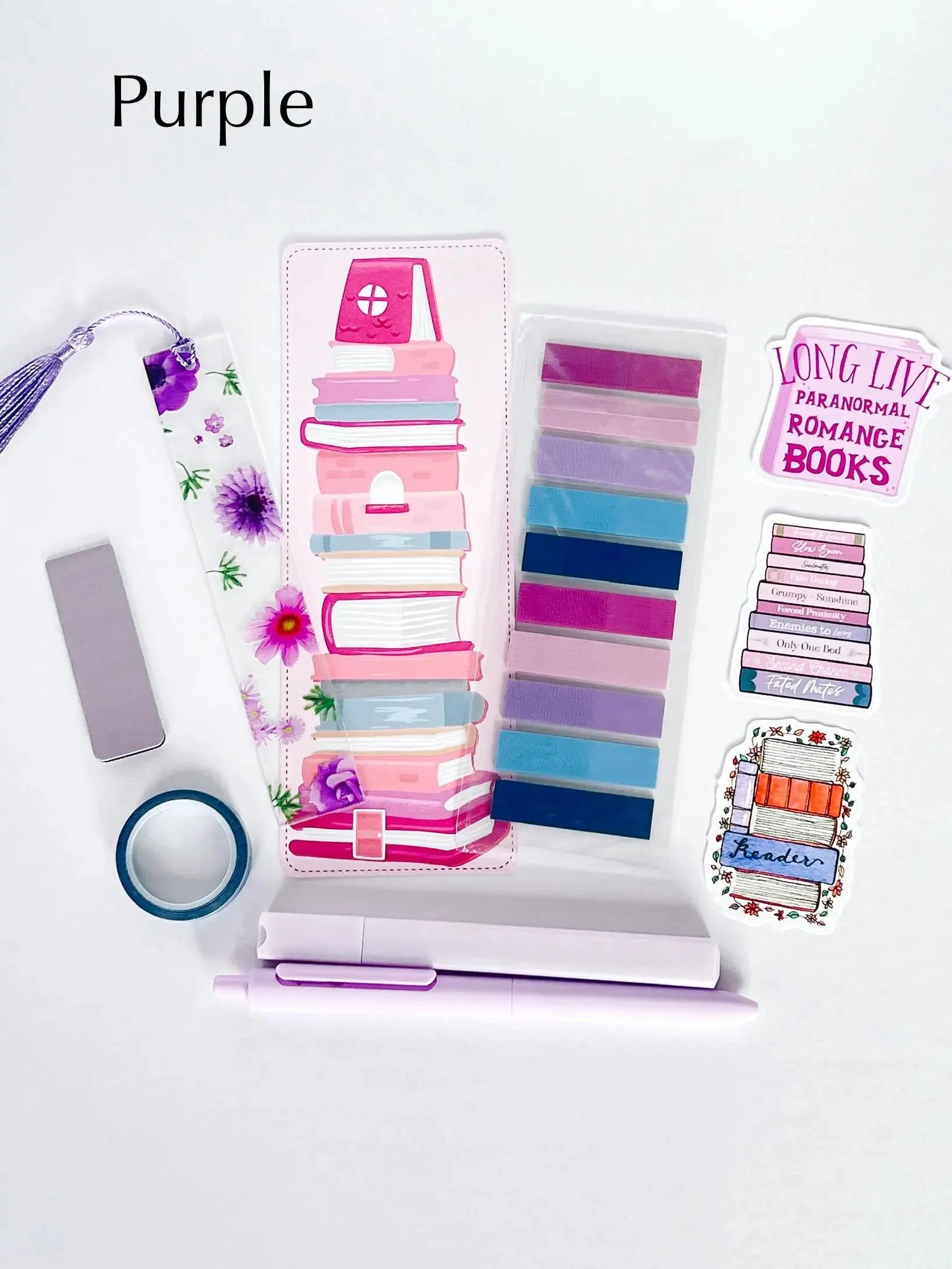 Flat lay of the Book Annotation Kit featuring highlighters, sticky notes, page tabs, pens, and other colorful tools for annotating and marking up books, all neatly arranged in a clear pouch."