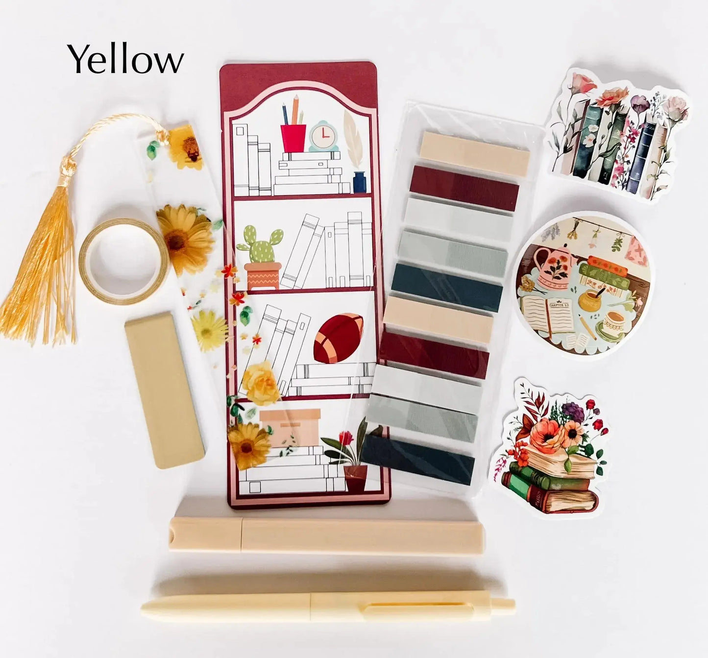 Flat lay of the Book Annotation Kit featuring highlighters, sticky notes, page tabs, pens, and other colorful tools for annotating and marking up books, all neatly arranged in a clear pouch."