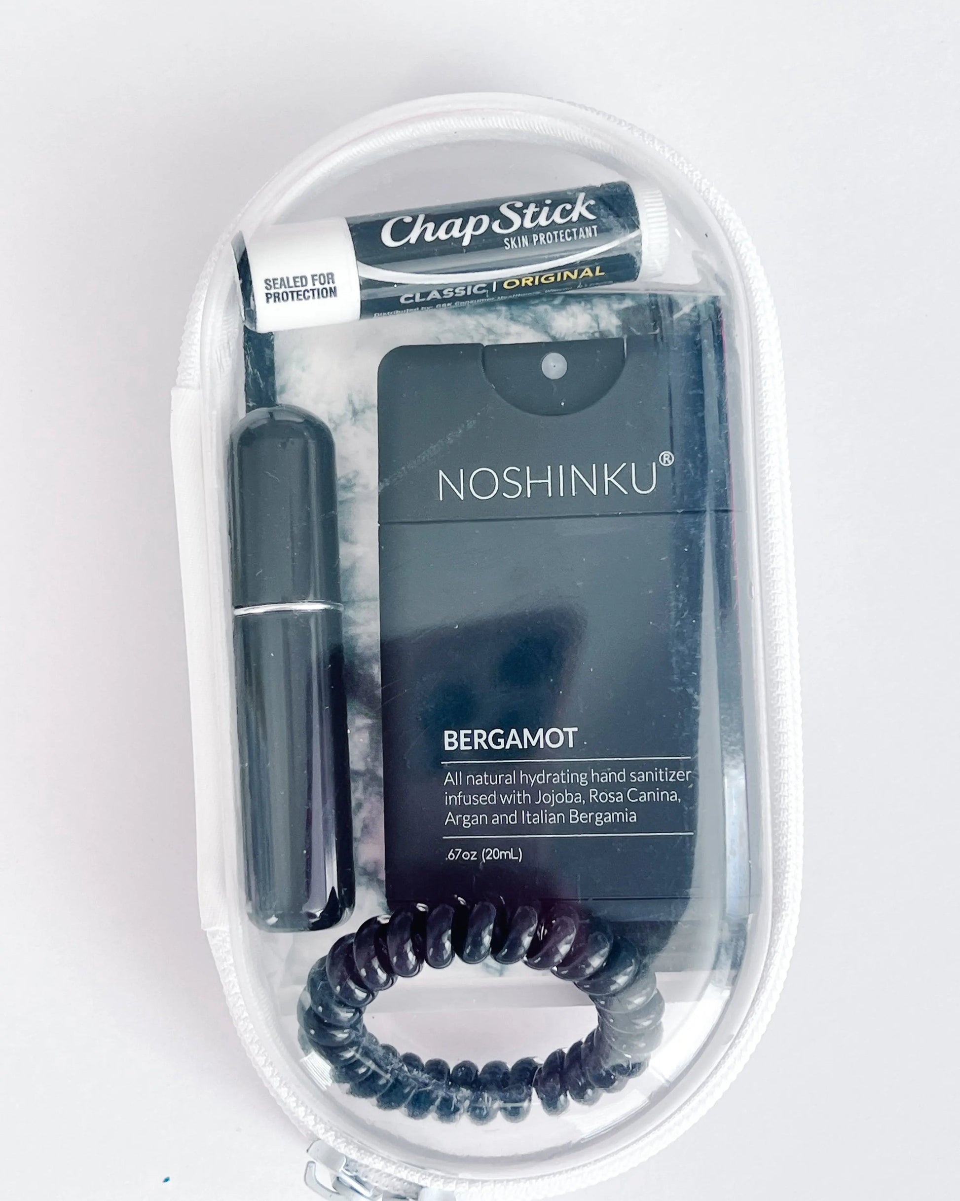 Everyday Essentials Kit filled with travel-size must-haves in black