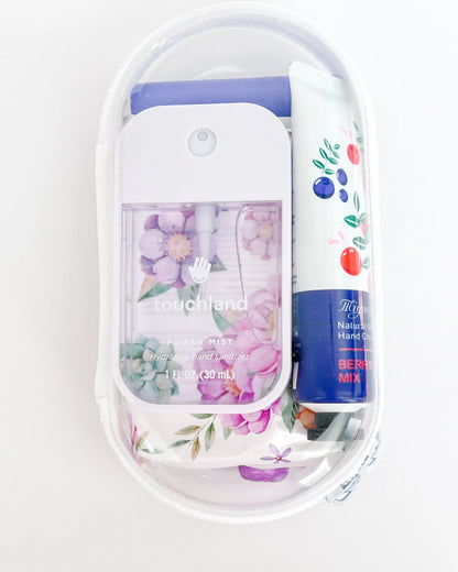 Everyday Essentials Kit filled with travel-size must-haves in purple. 