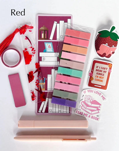 Flat lay of the Book Annotation Kit featuring highlighters, sticky notes, page tabs, pens, and other colorful tools for annotating and marking up books, all neatly arranged in a clear pouch."